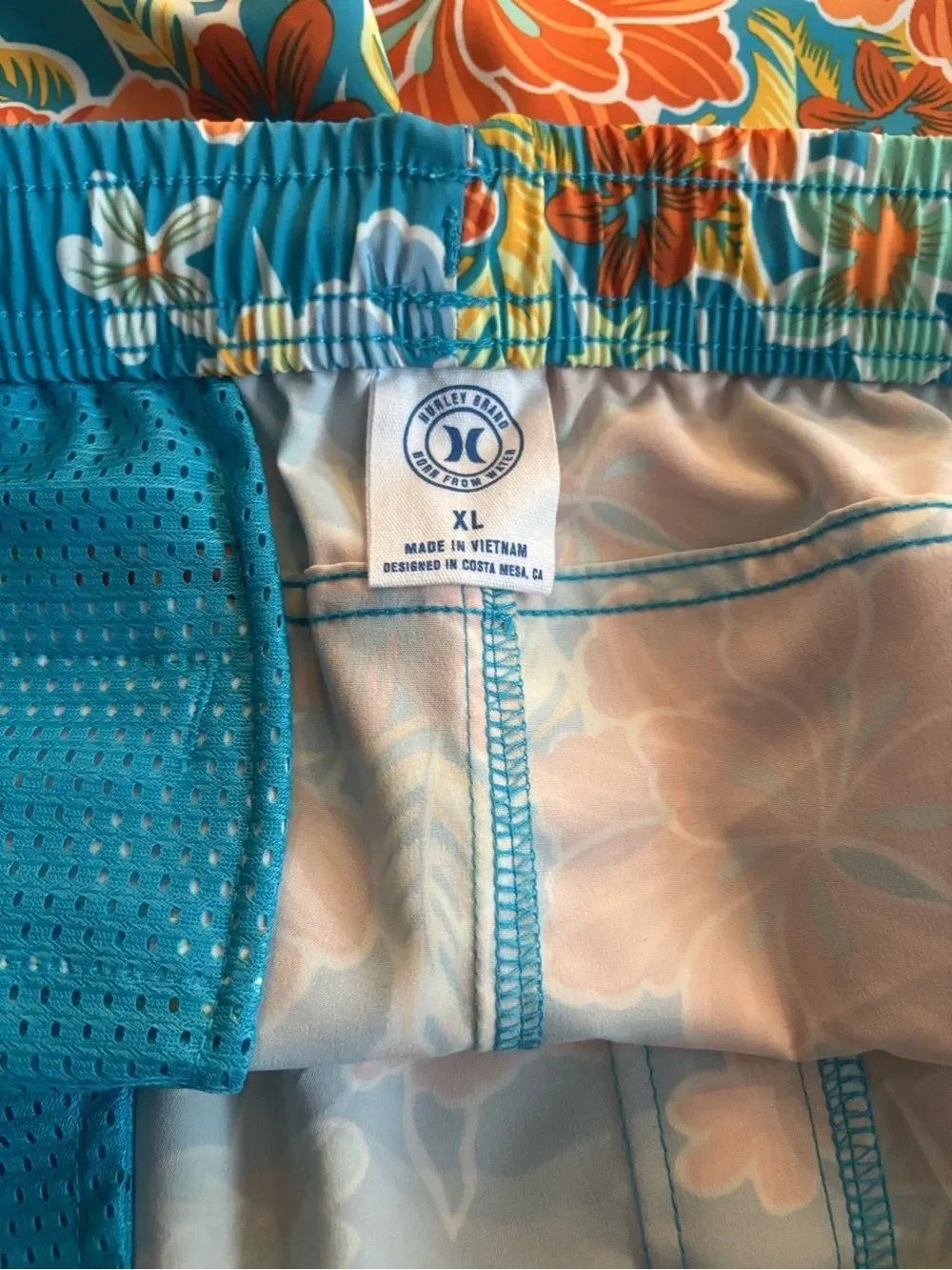 Hurley men’s  Teal Floral Swim Trunks - Vibrant Orange Hibiscus